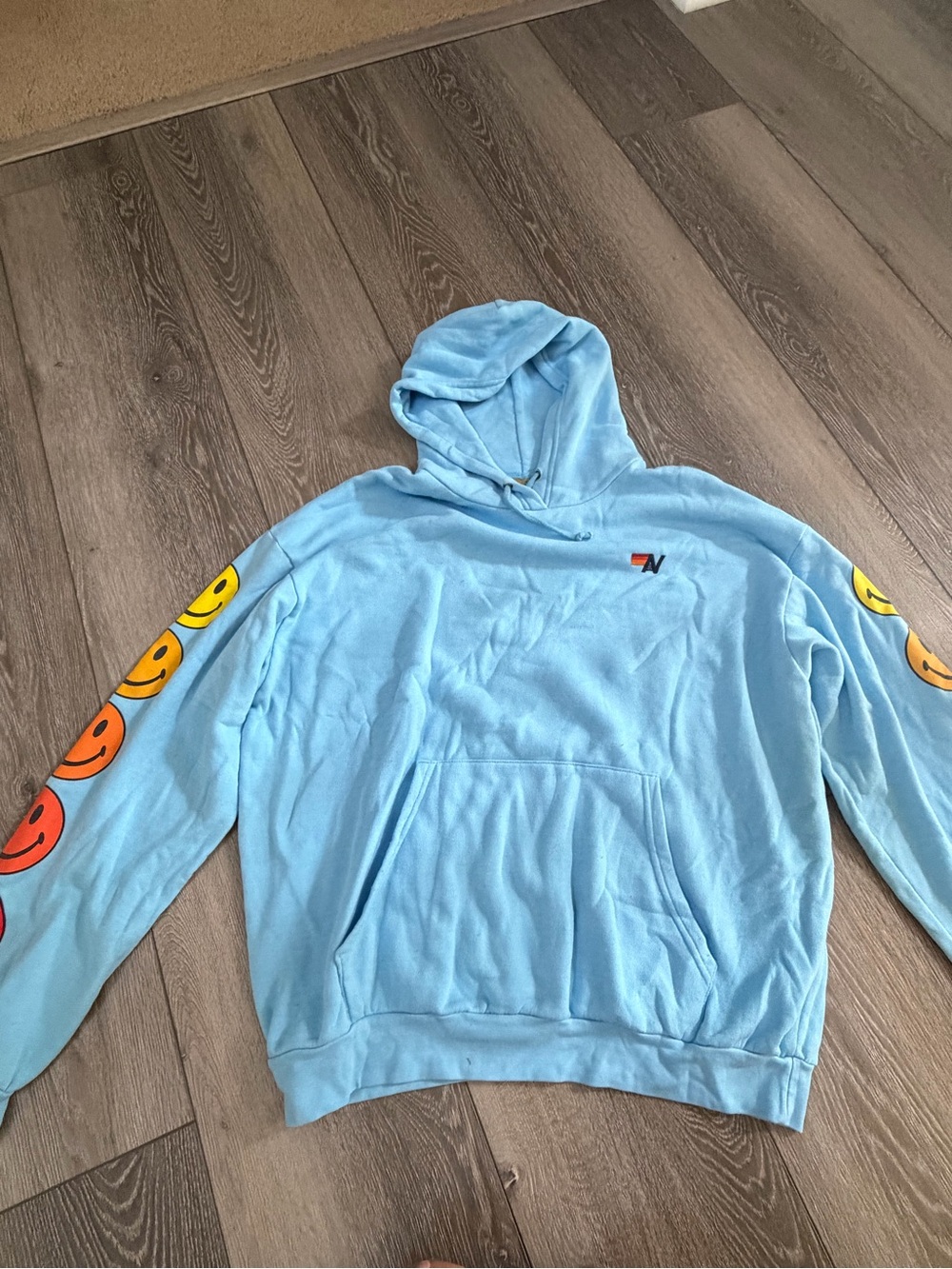 Aviator Nation Light Blue Hoodie with Smiley Sleeve Graphics